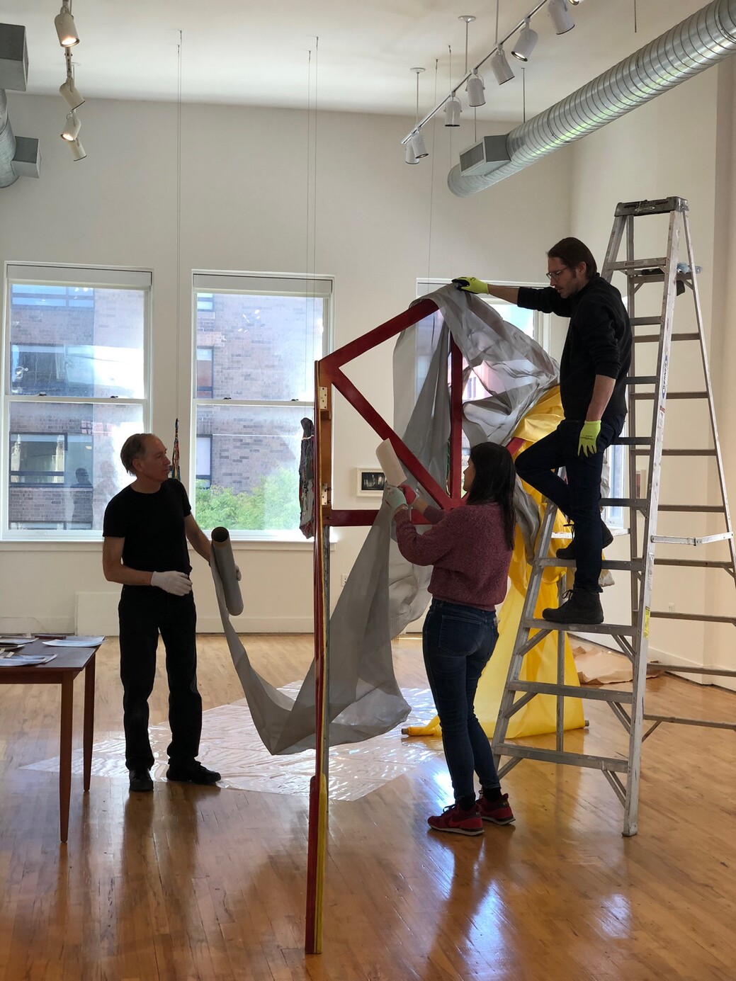 The Estate of Rosemary Mayer installing her sculpture Portae (1974), for the exhibition "Future Variations," at Soft Network, 2022. Photo by Sara VanDerBeek.